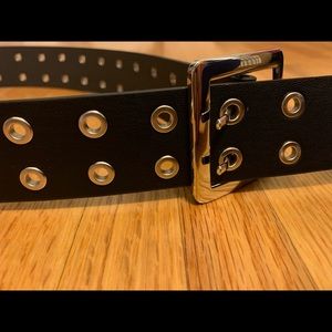 Black belt with metal-lined holes